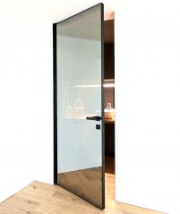 Bluebell Architectural Design Products Albed Doors Quadra Bilico pivot door open with reflex glass