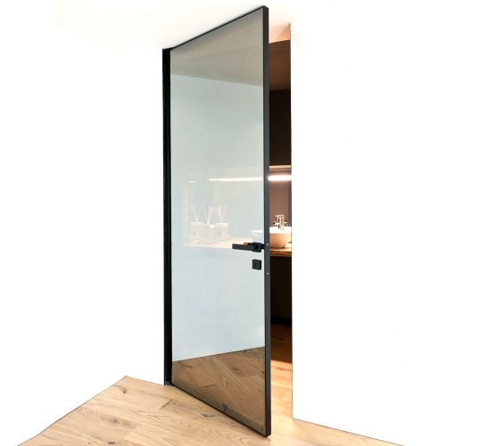 Bluebell Architectural Design Products Albed Doors Quadra Bilico pivot door open with reflex glass